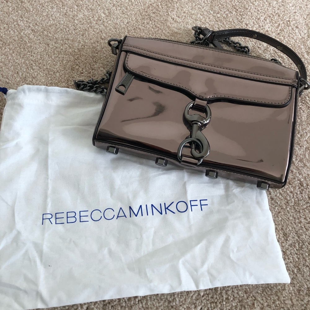 Platinum color Rebecca Minkoff crossbody purse.